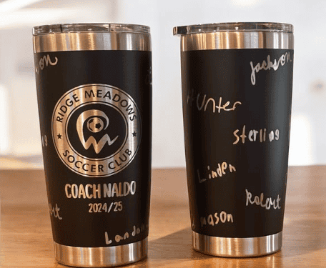 Customized chalkboard tumbler with handwritten sports and seasonal themes.